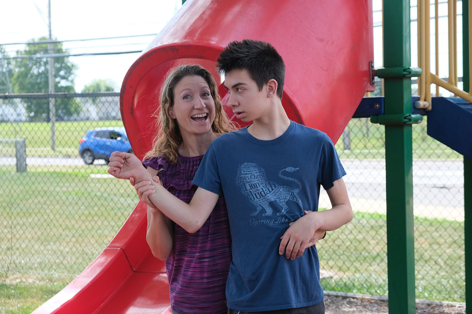 Woman and boy on playground